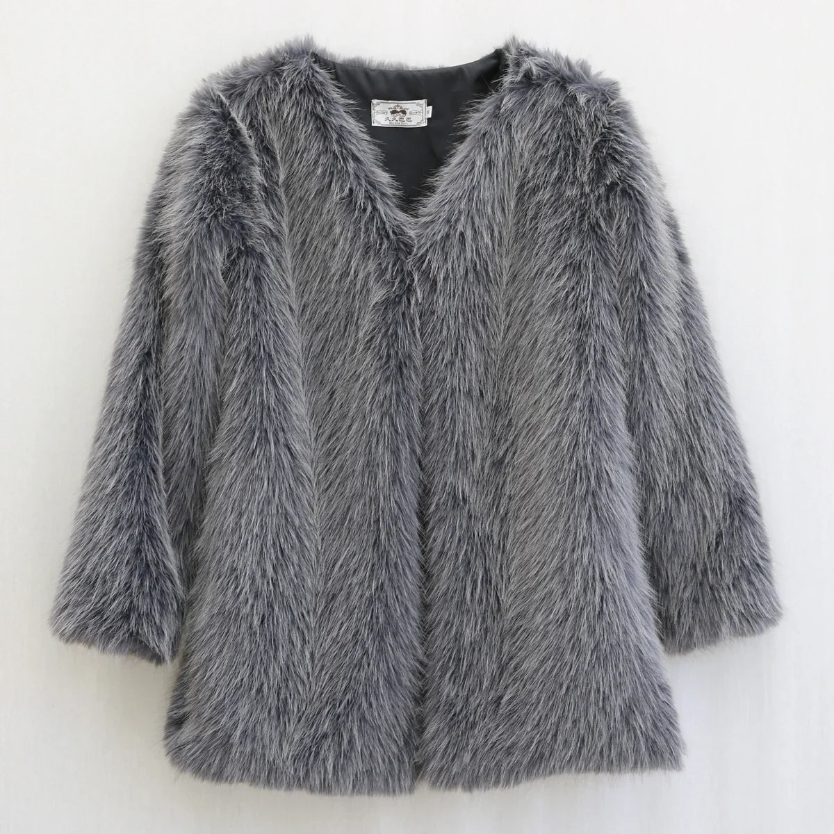 Stella | Zotteliger kunstpelzmantel für damen für einen auffälligen statement look